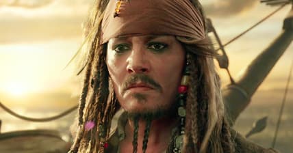 Captain Jack (Johnny Depp) bids farewell to Henry (Brenton Thwaites), Carina (Kaya Scodelario), Will (Orlando Bloom) and Elizabeth (Keira Knightley) in Pirates of the Caribbean: Dead Men Tell No Tales (2017), Disney