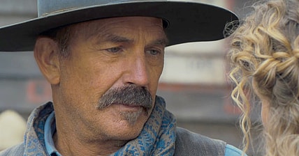 A gunslinger (Kevin Costner) receives a proposition from a 'lady of the night' in Horizon: An American Saga (2024), New Line Cinema