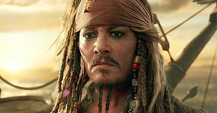 Captain Jack (Johnny Depp) bids farewell to Henry (Brenton Thwaites), Carina (Kaya Scodelario), Will (Orlando Bloom) and Elizabeth (Keira Knightley) in Pirates of the Caribbean: Dead Men Tell No Tales (2017), Disney