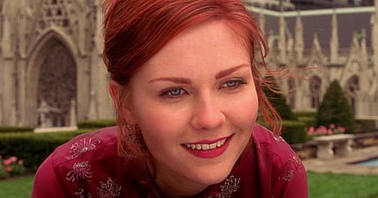 Mary-Jane Watson (Kirsten Dunst) watches as her new hero (Tobey Maguire) swings off into the sunset in Spider-Man (2002), Sony