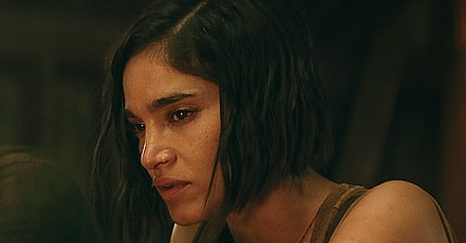 Rebel Moon — Part Two: The Scargiver. (L-R) Michiel Huisman as Gunnar and Sofia Boutella as Kora in Rebel Moon — Part Two: The Scargiver. Cr. Netflix © 2024.