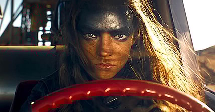 Furiosa (Anya Taylor-Joy) gets behind the wheel of a War Rig in Furiosa: A Mad Max Saga (2024), Warner Bros. Pictures