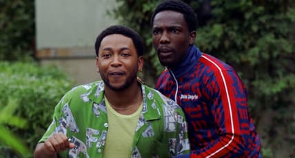 Kevin (Jacob Latimore) and Damon (Tosin Cole) are surprised by a visitor in House Party (2023), Warner Bros. Pictures