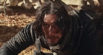 Mills (Adam Driver) is taken by surprise in 65 (2023), Sony Pictures