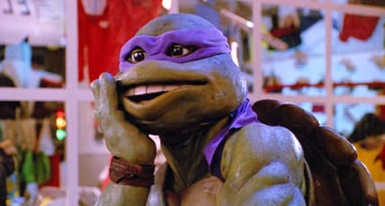 Donatello goes "Oops" after kicking a thug in Teenage Mutant Ninja Turtles II: The Secret of The Ooze (1991), New Line Cinema