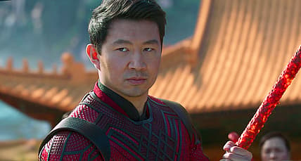 Shang-Chi (Simu Liu) defends Tao Lo from the Ten Rings in Shang-Chi and the Legend of the Ten Rings