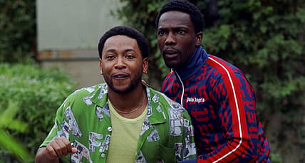 Kevin and Damon are surprised by a visitor in House Party (2023), Warner Bros. Pictures