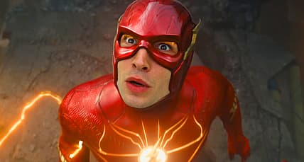 Barry Allen (Ezra Miller) watches as a hospital collapses in The Flash (2023), Warner Bros. Pictures