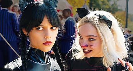 Wednesday (Jenna Ortega) and Enid (Emma Myers) win canoe race in Wednesday Season 1 (2022), Netflix