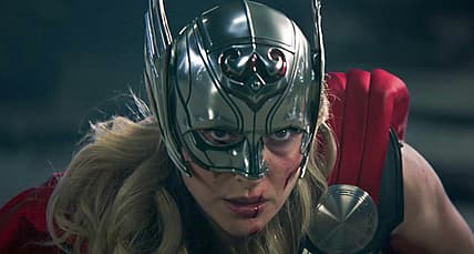 Jane Foster (Natalie Portman) swings at Gorr (Christian Bale) in Thor: Love and Thunder (2022)