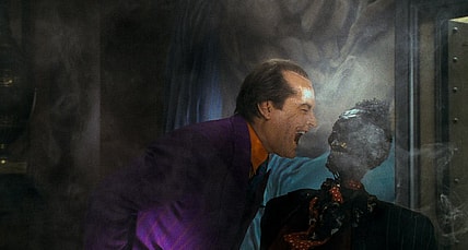 The Joker laughs at the corpse of a mob boss in 'Batman' (1989), Warner Bros. Pictures