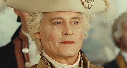 Louis XV (Johnny Depp) is stricken by Jeanne du Barry (Maïwenn) in Jeanne du Barry (2023), La Pacte