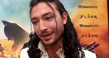 Ezra Miller speaks to TheMovieReport.com on The Flash's red carpet