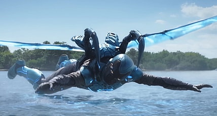 Jamie Reyes (Xolo Maridueña) breaks his fall in Blue Beetle (2023), DC Studios