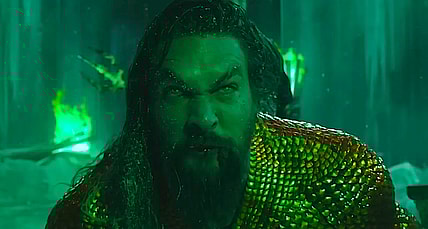 A revengeful Aquaman (Jason Momoa) stands in front of Black Manta (Yahya Abdul-Mateen) in Aquaman and the Lost Kingdom (2023), Warner Bros. Pictures