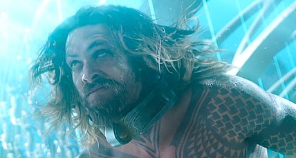 Arthur Curry (Jason Momoa) stands in front of King Orm (Patrick Wilson) in Aquaman (2018), Warner Bros. Pictures