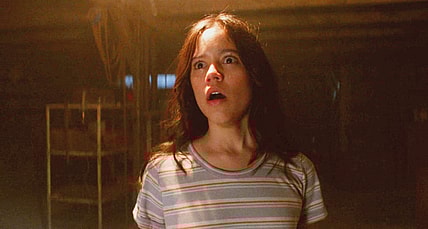 Lorraine (Jenna Ortega) finds her mutilated boyfriend in X (2022), A24