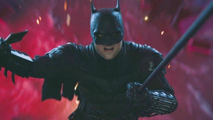 Batman (Robert Pattinson) narrowly escapes The Riddler's (Paul Dano) attempt to drown him in The Batman (2022), Warner Bros. Pictures