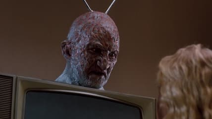 Freddy (Robert Englund) has a lesson for Jennifer (Penelope Sudrow) about limiting TV consumption in A Nightmare on Elm Street 3: Dream Warriors (1987), New Line Cinema