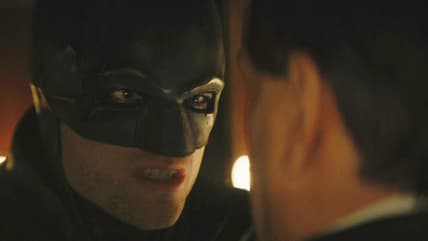 Batman (Robert Pattinson) demands answers from The Penguin (Colin Farrell) in The Batman (2022), Warner Bros. Pictures