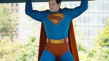 David Corenswet as Superman catches falling debris in Superman (2025), DC Studios