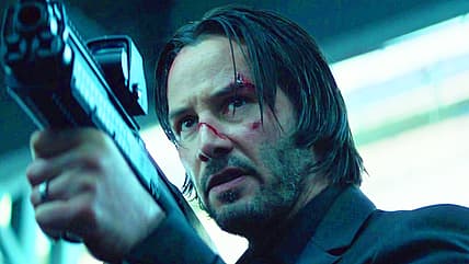 John Wick (Keanu Reeves) draws Kel-Tec KSG on Viggo Tarasov (Michael Nyqvist) in John Wick (2014)