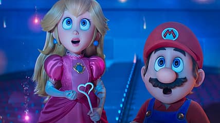 Peach and Mario stare in amazement at a landing spaceship in The Super Mario Galaxy Movie (2026)