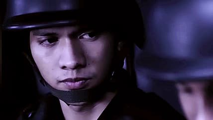 Iko Uwais wears helmet preparing for war in The Raid (2011), Sony Pictures Classics