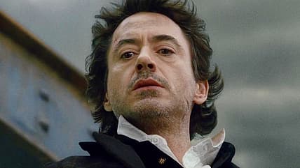 Holmes (Robert Downey Jr.) watches Lord Blackwood (Mark Strong) choke on the Tower Bridge skeleton