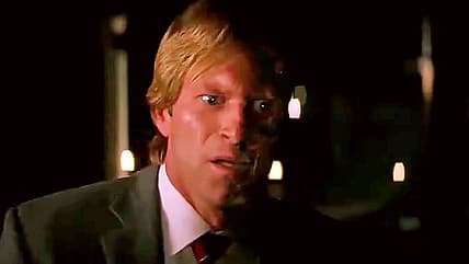 Harvey Dent (Aaron Eckhart) isn't expecting to escape fate in The Dark Knight (2008), Warner Bros. Pictures