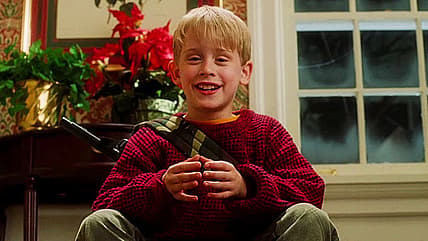Kevin (Macaulay Culkin) is ready for more in Home Alone (1990), 20th Century Fox