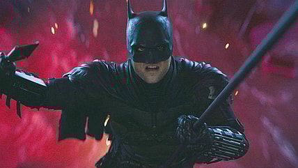 Batman (Robert Pattinson) narrowly escapes The Riddler's (Paul Dano) attempt to drown him in The Batman (2022), Warner Bros. Pictures