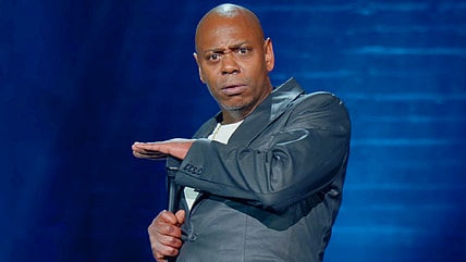 Dave Chappelle delivers a punchline in The Closer (2023), Netflix