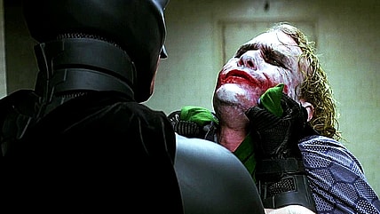 Batman (Christian Bale) doesn’t clown around with Joker (Heath Ledger) in The Dark Knight (2008), Warner Bros. Pictures