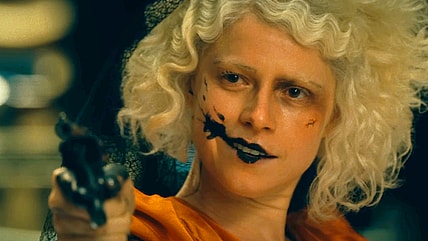 The Bride (Jessie Buckley) commits a stick-up in The Bride! (2026), Warner Bros. Pictures