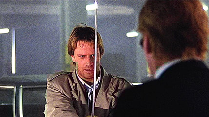 Connor (Christopher Lambert) duels with Fasil (Peter Diamond) over a parking space in Highlander (1986), 20th Century Fox