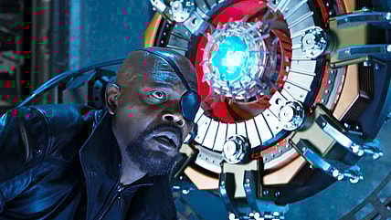 Nick Fury (Samuel L. Jackson) is stunned to find SHIELD is under attack by Loki (Toim Hiddleston) in The Avengers (2012), Marvel Entertainment