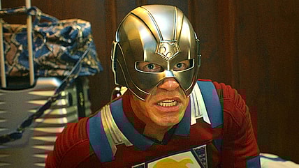 The Earth-2 Peacemaker (John Cena) prepares to launch a pair of helmet-fired ninja stars in Peacemaker Season 2 Episode 1 "The Ties That Grind" (2025), DC Studios