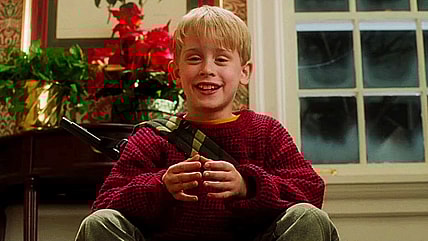 Kevin (Macaulay Culkin) is ready for more in Home Alone (1990), 20th Century Fox