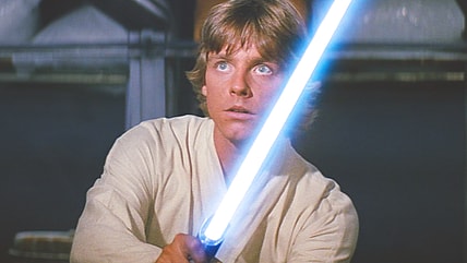 Luke Skywalker (Mark Hamill) wields his father's lightsaber for the first time in Star Wars: Episode IV - A New Hope (1977), Lucasfilm
