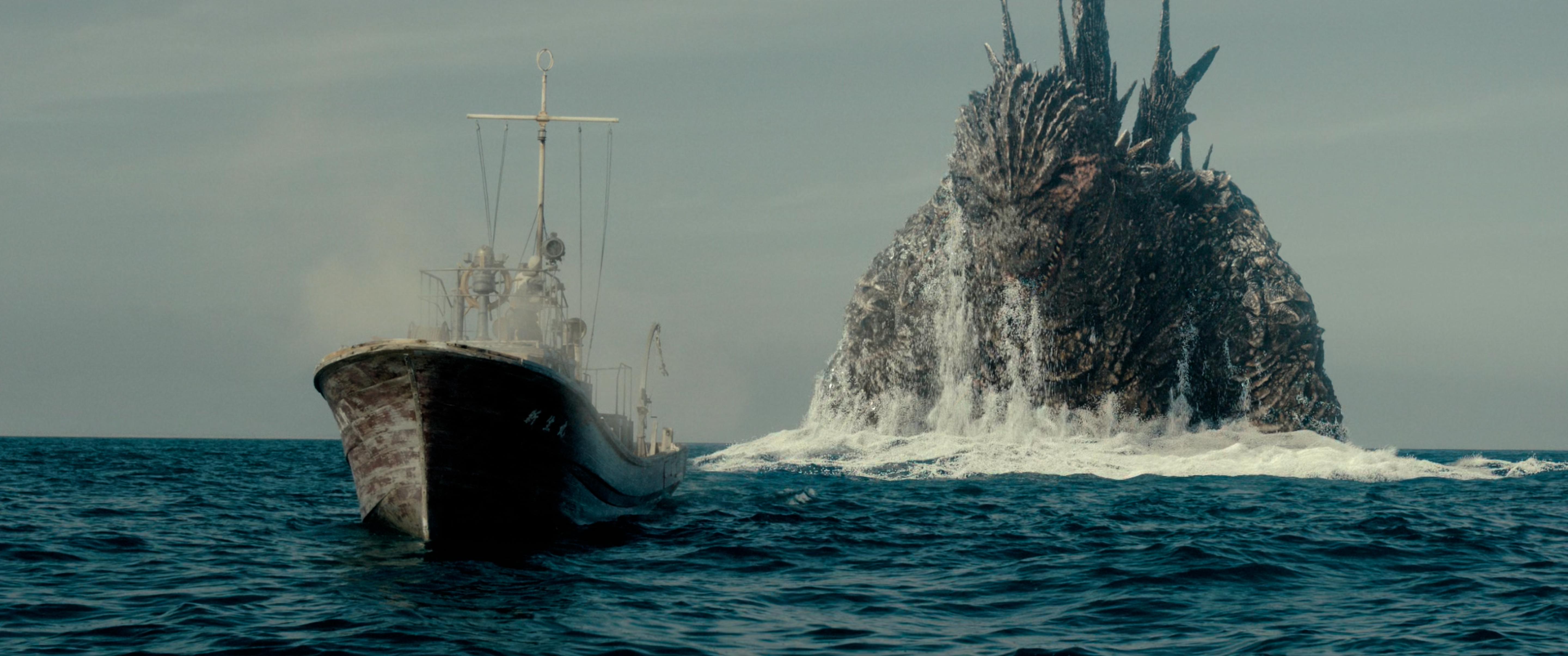 Godzilla emerges in front of a frightened crew in Godzilla Minus One (2023), Toho Co. Ltd.