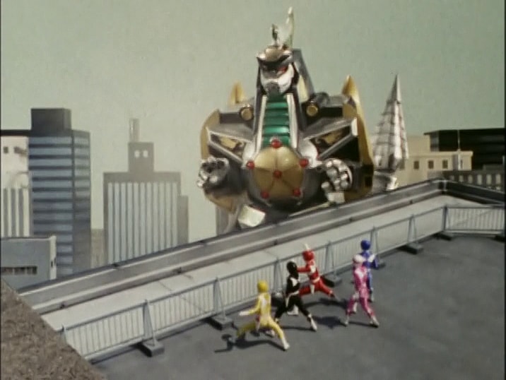 The titular team stands in awe of Burai's (Shiro Izumi) on the Guardian Beast DragonCasear in
Kyoryu Sentai Zyuranger Episode 21 "The Guardian Beast's Great Riot" (1992), Toei Co. Ltd.