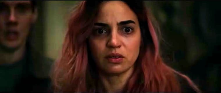 A Deadite raises a glass to Souheila Yacoub and family in Evil Dead Burn (2026), Warner Bros. Pictures