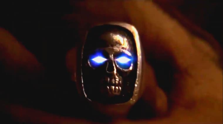 The first Ghost Who Walks is bestowed a fitting mood ring in The Phantom (1996), Village Roadshow Pictures