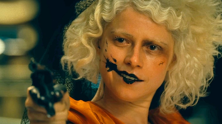 The Bride (Jessie Buckley) commits a stick-up in The Bride! (2026), Warner Bros. Pictures