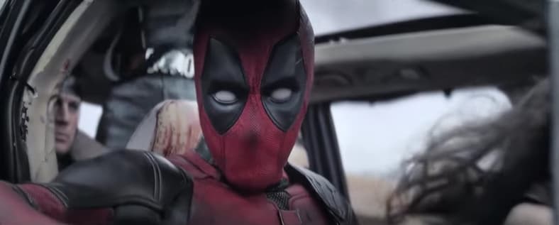 Deadpool (Ryan Reynolds) in a damaged car in Deadpool & Wolverine (2024), Marvel Studios
