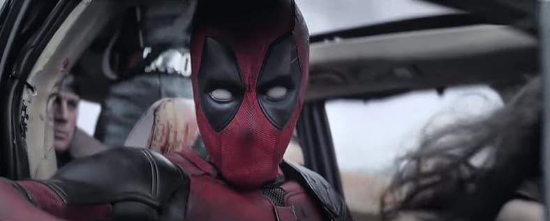 Deadpool (Ryan Reynolds) in a damaged car in Deadpool & Wolverine (2024), Marvel Studios