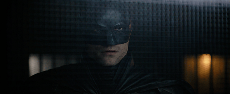 Batman (Robert Pattinson) learns The Riddler's (Paul Dano) real plan in The Batman (2022), Warner