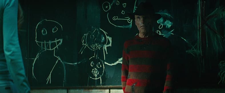 Freddy (Jackie Earle Haley) demerits a student for sleeping in class in A Nightmare On Elm Street (2010), Platinum Dunes