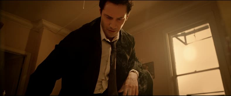 John Constantine (Keanu Reeves) prepares to exorcise a demon in Constantine (2005), Warner Bros
